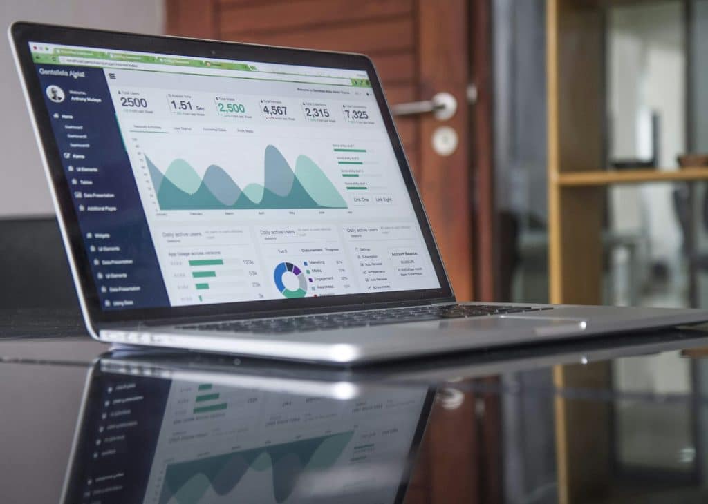 Performance statistics and charts displayed on a laptop screen